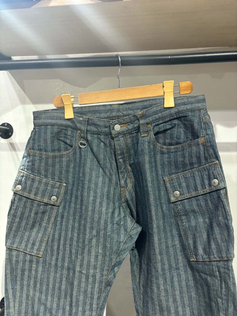 Kojima Genes Herringbone Denim Cargo Pants Size 36 (Category: Jeans) located in Bambang. Submitted by heats777 (Listing ID 1467502374, Image 1). Description: - Brand: Kojima Genes - Style: Herringbone denim cargo pants with vertical stripe pattern - Color: Indigo blue - Size: 36 - Material: 100% cotton (Japanese raw denim) - Features: Multiple utility pockets, metal button fly, genuine leather back patch - Condition: Excellent craftsmanship and q