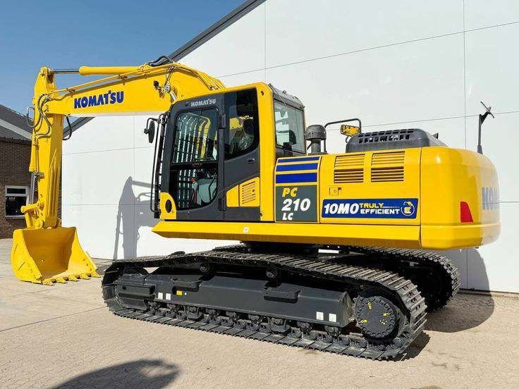 Komatsu PC210LC Crawler Excavator (Category: Heavy Vehicles) located in Caloocan City. Submitted by xcmgmachinery (Listing ID 1467369050, Image 1). Description: Komatsu PC210LC crawler excavator. Bright yellow body, black tracks, enclosed cab. Heavy-duty bucket attached at the front. Clean exterior paint, minimal wear on the steel tracks. Ready for construction sites and heavy earthmoving work. Pick up arrangement to be discussed due to size and 
