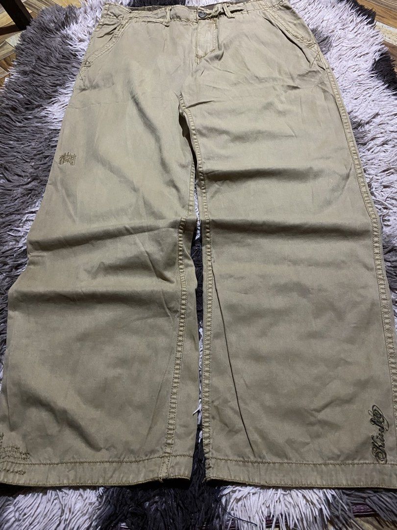 Kurt K Beige Cargo Pants Size 34 (Category: Trousers) located in Caloocan City. Submitted by remythrift (Listing ID 1467542318, Image 1). Description: Beige cotton cargo pants with plaid inner lining and waistband detailing. Multiple pockets, loose fit silhouette. Size tag reads 34. Subtle embroidery details near the bottom hems..