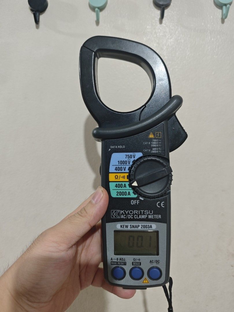 Kyoritsu KEW Snap 2003A AC/DC Clamp Meter (Category: Construction Tools & Equipment) located in Cavite. Submitted by pauduro (Listing ID 1467561884, Image 2). Description: - Brand: Kyoritsu (Made in Thailand) - Model: KEW Snap 2003A AC/DC Clamp Meter - Condition: Powers on clearly with a crisp digital display, clear serial number on the back - Functions: Accurately measures AC/DC voltage, current, and resistance - Inclusions: Original black Kyori