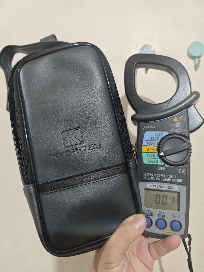 Kyoritsu KEW Snap 2003A AC/DC Clamp Meter (Category: Construction Tools & Equipment) located in Cavite. Submitted by pauduro (Listing ID 1467561884, Image 1). Description: - Brand: Kyoritsu (Made in Thailand) - Model: KEW Snap 2003A AC/DC Clamp Meter - Condition: Powers on clearly with a crisp digital display, clear serial number on the back - Functions: Accurately measures AC/DC voltage, current, and resistance - Inclusions: Original black Kyori