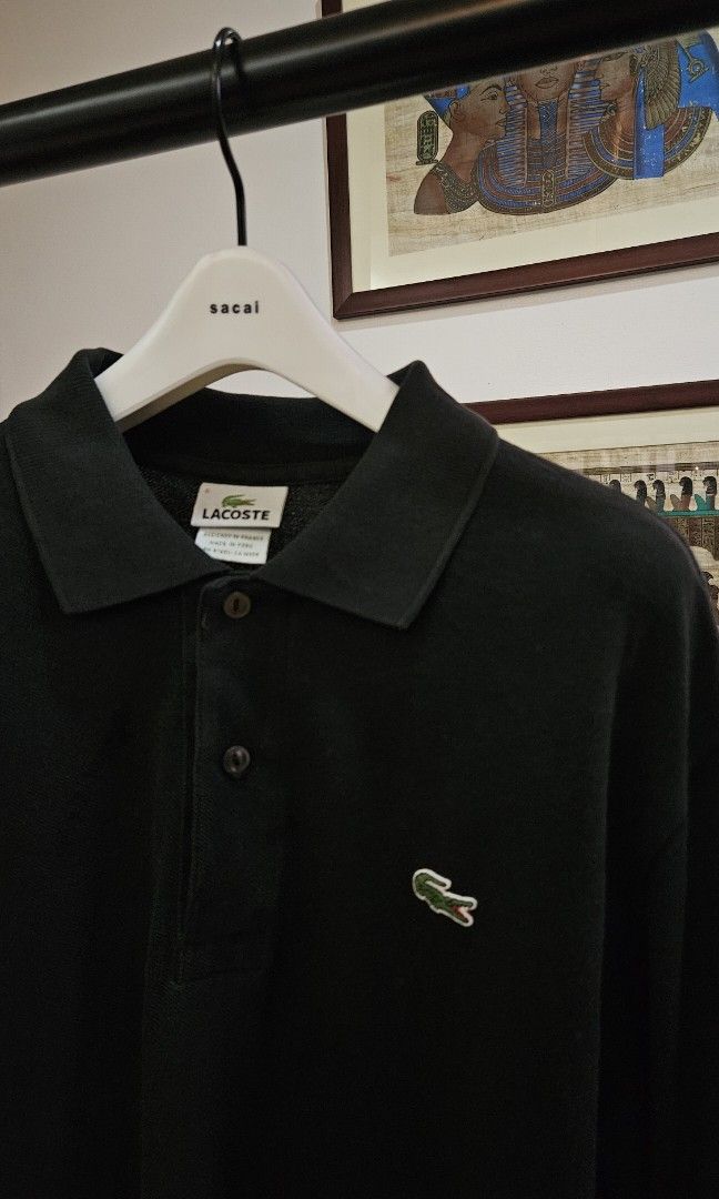 Lacoste Black Polo Shirt Size 5 (Category: Tshirts & Polo Shirts ) located in Alfonso. Submitted by jbcamet (Listing ID 1466878540, Image 2). Description: - Brand: Lacoste - Color: Black - Size: 5 - Material: 100% cotton - Origin: Made in Peru - Details: Classic two-button placket, embroidered crocodile logo, ribbed collar and cuffs.