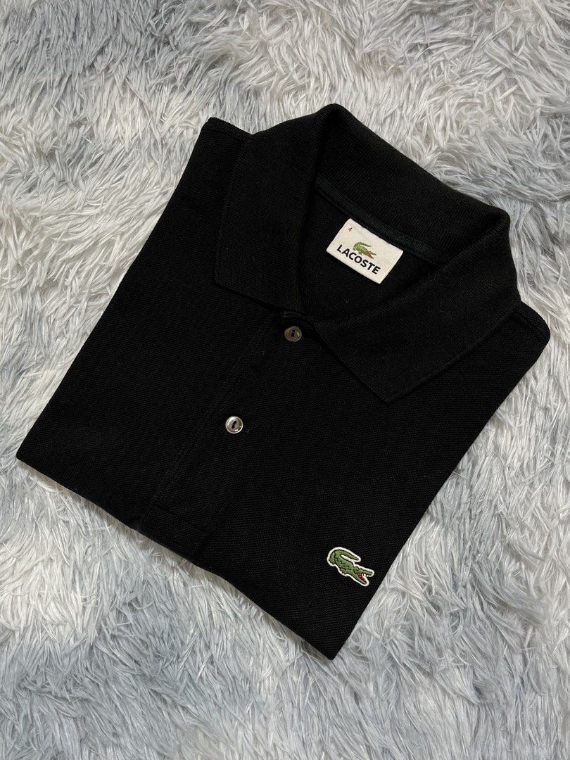 Lacoste Black Polo Shirt Size 4 Devanlay (Category: Tshirts & Polo Shirts ) located in Tagum. Submitted by formalfits.ph (Listing ID 1467454248, Image 2). Description: Black Lacoste polo shirt in size 4. Classic collar with two buttons. Classic green crocodile logo embroidered on the chest. Material is 100% cotton, made by Devanlay. Standard short sleeve casual wear. Clean condition, tags shown in pictures..