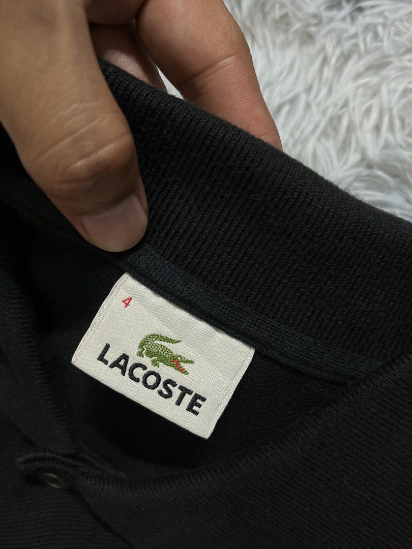 Lacoste Black Polo Shirt Size 4 Devanlay (Category: Tshirts & Polo Shirts ) located in Tagum. Submitted by formalfits.ph (Listing ID 1467454248, Image 3). Description: Black Lacoste polo shirt in size 4. Classic collar with two buttons. Classic green crocodile logo embroidered on the chest. Material is 100% cotton, made by Devanlay. Standard short sleeve casual wear. Clean condition, tags shown in pictures..