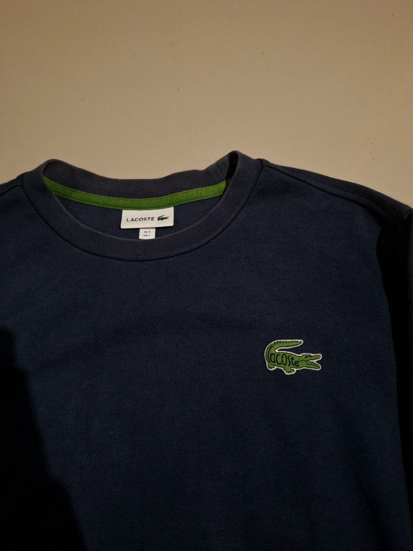 Lacoste Crew neck sweatshirt (Category: Coats, Jackets and Outerwear) located in Cebu City. Submitted by authentica.28 (Listing ID 1467546696, Image 2). Description: Size Large 23/27 dimes Issue: Very tiny slit on sleeve (not noticeable) Very good condition good for resell or for use AUTHENTICITY GUARANTEED✅️.