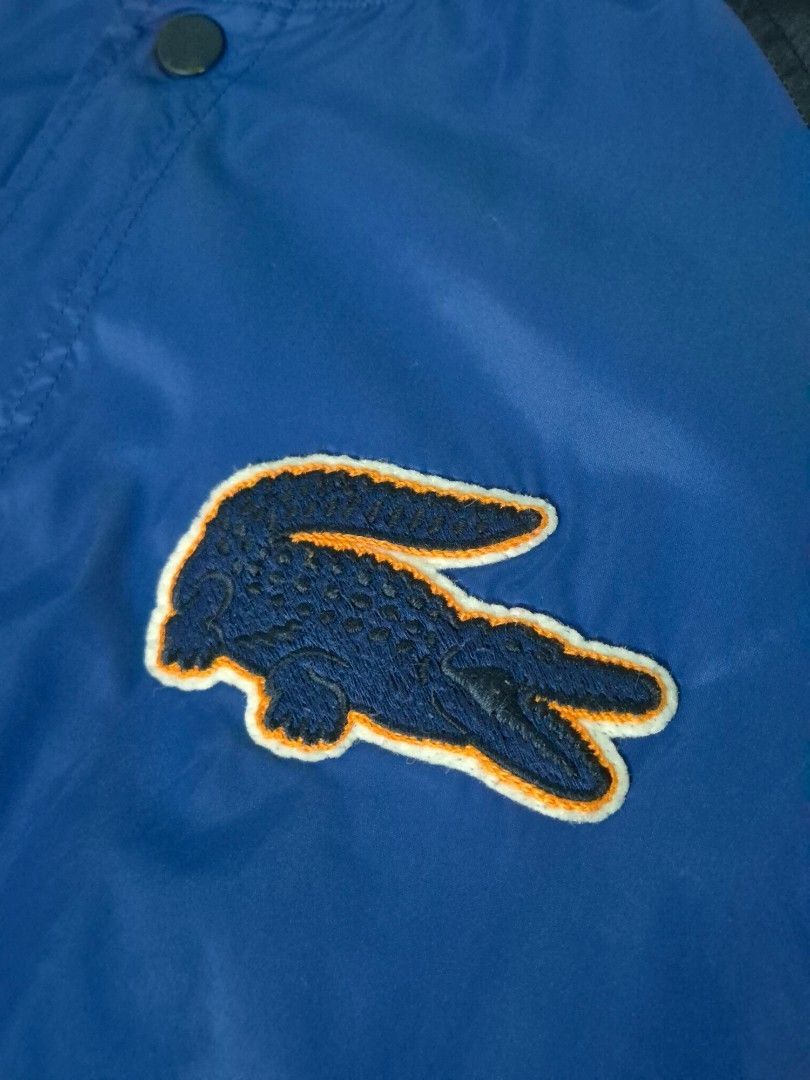 Lacoste Live Varsity Jacket (Category: Coats, Jackets and Outerwear) located in Manila. Submitted by Metronome (Listing ID 1467384843, Image 3). Description: Lacoste Varsity Jacket, 100% LEGIT or your money back. Well-kept, Personal item, 1st owner, not thrifted Excellent Condition 9.6/10 overall, Diko din masyado nagamit, as seen sa photos internal and outside is still immaculate ; except for the button, pls see last pic, Not noticeable when wor