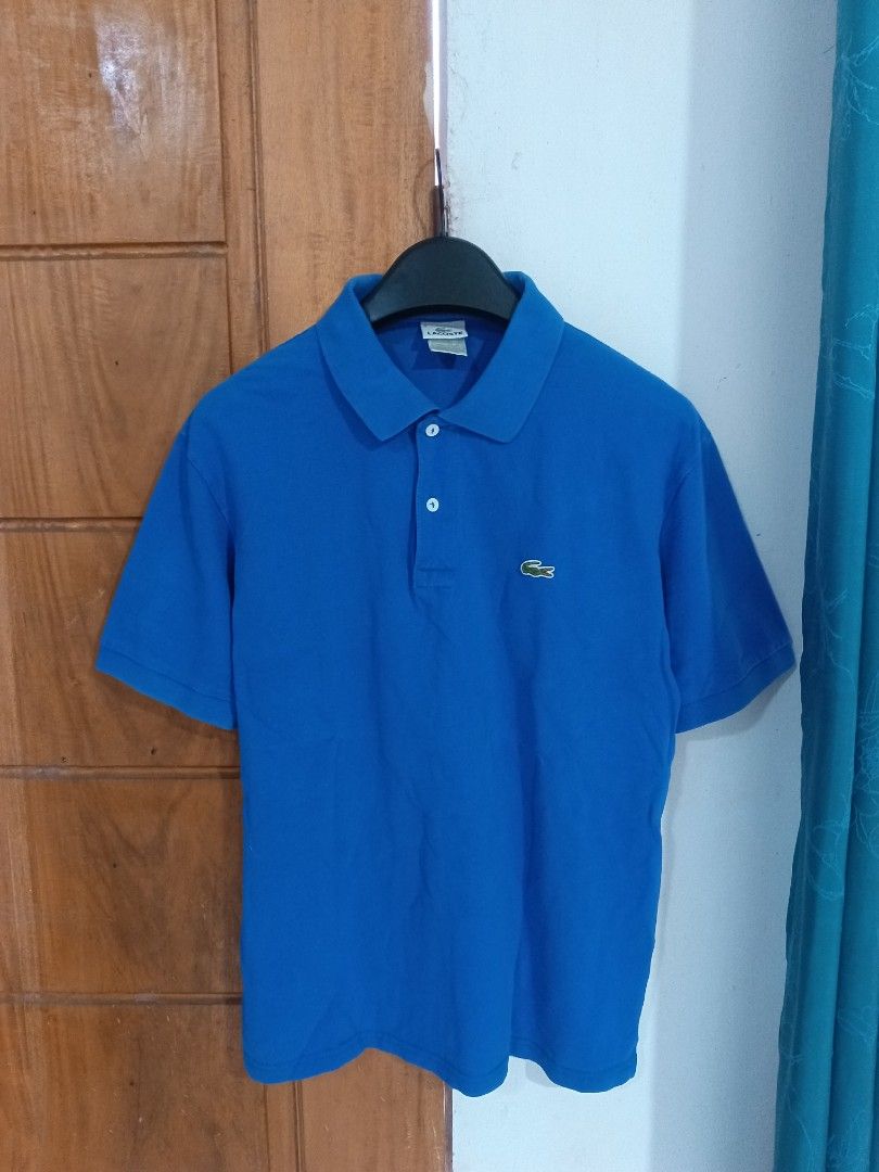 Lacoste Polo Shirt (Category: Tshirts & Polo Shirts ) located in Cebu City. Submitted by authenticgrids (Listing ID 1467508268, Image 1). Description: Lacoste Polo Shirt Royal Blue Color Excellent Condition ✨ Issue/s: None Size: On Tag 4 🏷️ M Dimensions Width 20 inches Length 27 inches Very Good Colorway , perfect for Casual Wear ✨ 📥📥📥📥📥 DM us for more details.