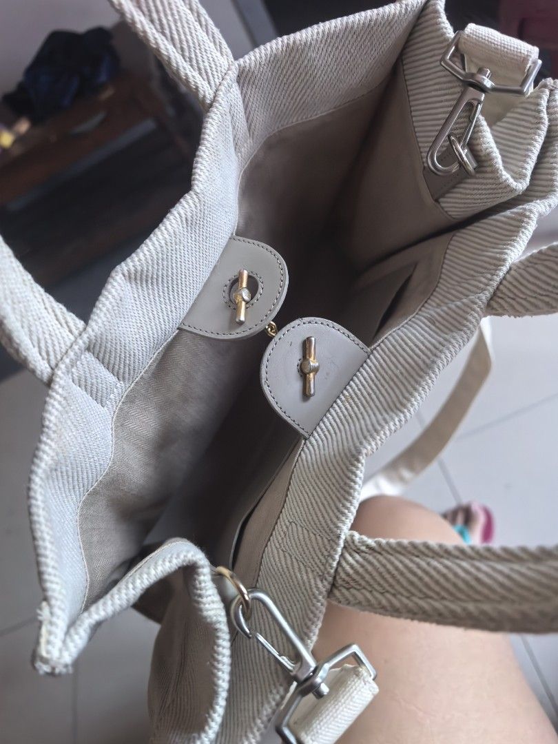 Lanvin Collection Canvas Tote Bag (Category: Tote Bags) located in Cagayan de Oro. Submitted by tommygurl1218 (Listing ID 1467368675, Image 3). Description: - Brand: Lanvin Collection - Material: Beige textured canvas with light beige fabric interior - Design: Front embroidered Lanvin lettering with pearl embellishments - Closure: Secure toggle closure - Handles & Strap: Dual top handles plus an adjustable and removable shoulder strap - Hardware: