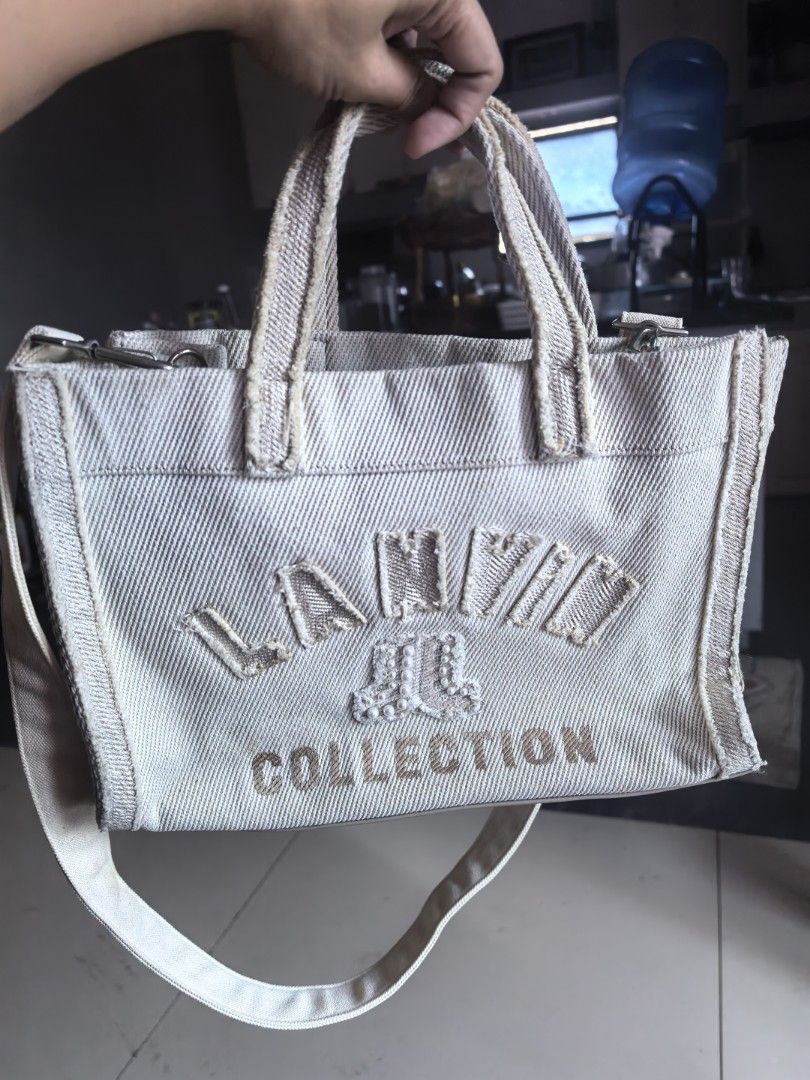 Lanvin Collection Canvas Tote Bag (Category: Tote Bags) located in Cagayan de Oro. Submitted by tommygurl1218 (Listing ID 1467368675, Image 1). Description: - Brand: Lanvin Collection - Material: Beige textured canvas with light beige fabric interior - Design: Front embroidered Lanvin lettering with pearl embellishments - Closure: Secure toggle closure - Handles & Strap: Dual top handles plus an adjustable and removable shoulder strap - Hardware: