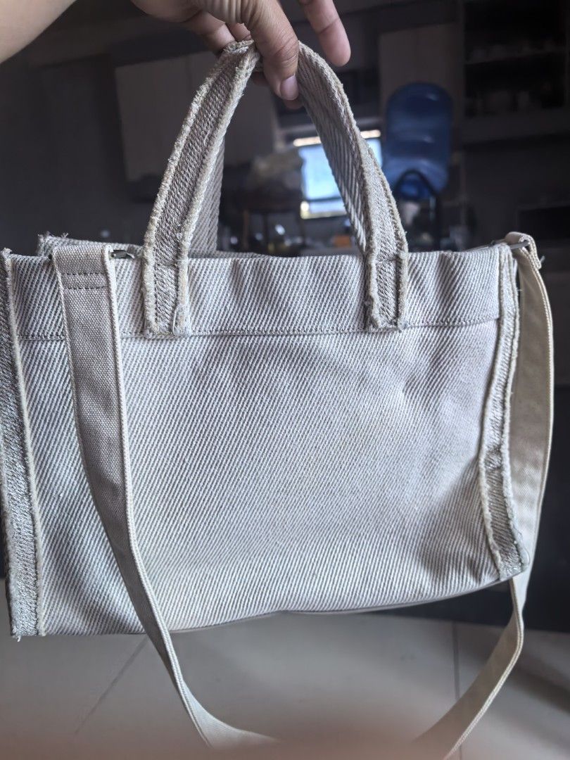 Lanvin Collection Canvas Tote Bag (Category: Tote Bags) located in Cagayan de Oro. Submitted by tommygurl1218 (Listing ID 1467368675, Image 2). Description: - Brand: Lanvin Collection - Material: Beige textured canvas with light beige fabric interior - Design: Front embroidered Lanvin lettering with pearl embellishments - Closure: Secure toggle closure - Handles & Strap: Dual top handles plus an adjustable and removable shoulder strap - Hardware: