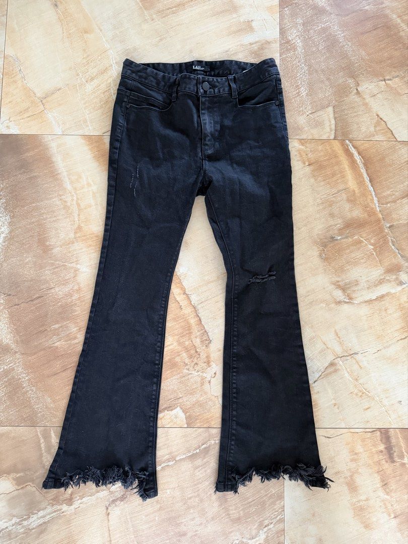 LAP Black Distressed Flare Jeans (Category: Jeans) located in Manila. Submitted by cleverfox.a30bf1 (Listing ID 1467421104, Image 1). Description: - Brand: LAP - Color: Black - Style: Flare jeans with mid-rise waist and button closure - Details: Distressed on right thigh and left knee with raw frayed hems - Fit: Slightly stretchy denim for a comfortable fit - Pockets: Standard front and back pockets.