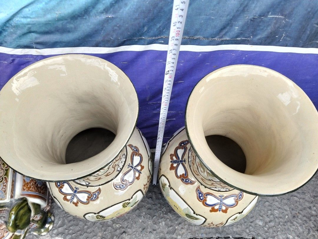 Large Vintage Ceramic Floor Vases Pair Butterfly Floral Pattern (Category: Vases & Decorative Bowls) located in Manila. Submitted by raymundm36884 (Listing ID 1467402341, Image 3). Description: - Type: Pair of large decorative ceramic floor vases - Height: Approx. 31 inches tall - Design: Hand-painted yellow chrysanthemums, pink peonies, butterflies, and intricate scrollwork -P25,000.00 Pair - Finish: Cream base glaze with dark brown trim on rims