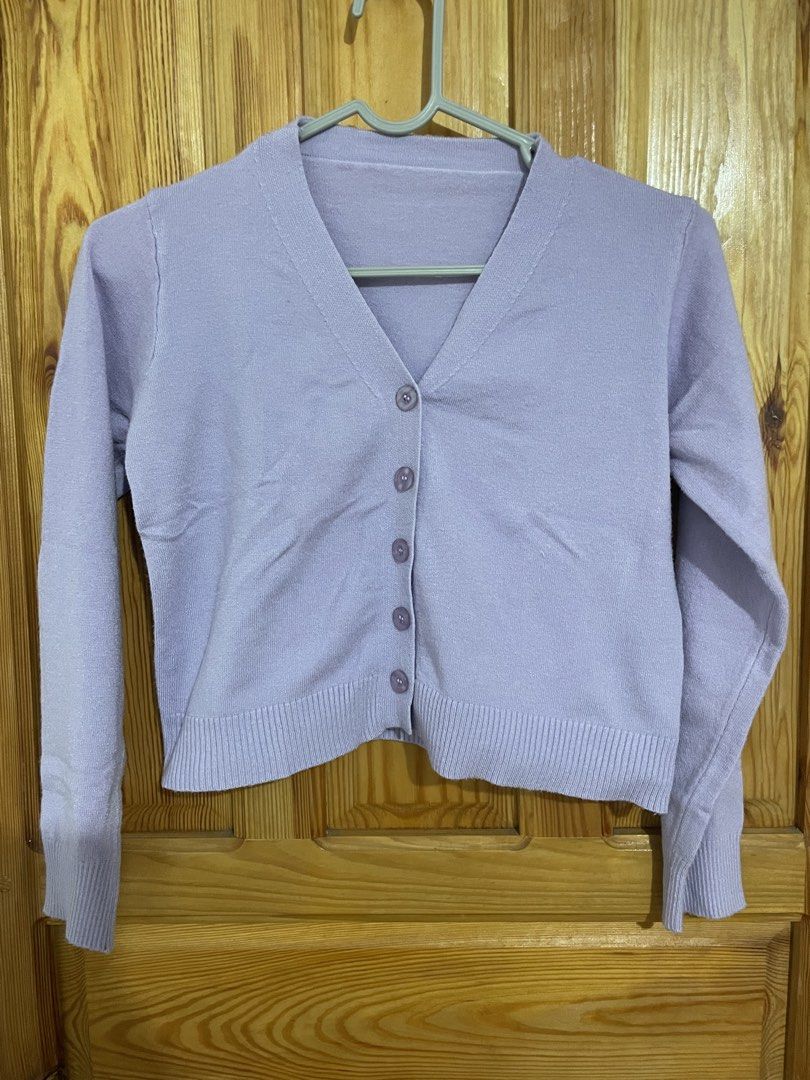 Lavender V-Neck Button-Up Cardigan (Category: Coats, Jackets and Outerwear) located in Baguio. Submitted by gbwardrobe (Listing ID 1467391599, Image 1). Description: - Color: Soft lilac - Style: Classic V-neck cardigan with 5 matching front buttons - Material: Lightweight, comfortable knit - Details: Ribbed hem and cuffs, long sleeves - Fit: Fits true to standard sizing - Condition: Clean finish, great for layering on cooler days Bought it in jp.