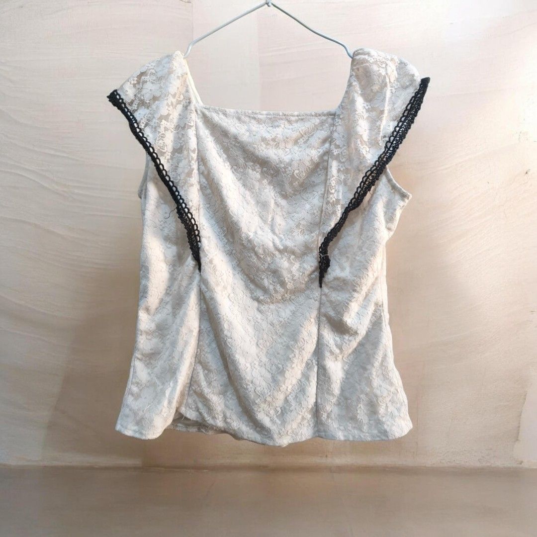 Lee white Lace Blouse Black Trim Size L (Category: Blouses) located in Taguig. Submitted by deyerreC2020 (Listing ID 1467462341, Image 2). Description: sale blouse Chic white lace sleeveless blouse from branded Mr. Lee, bust 39 inc. Size L. preloved blouse Features a square neckline with black trim, three chest bands, round black buttons down the front. Fully lined and ready to wear! in good condition, need wash ..