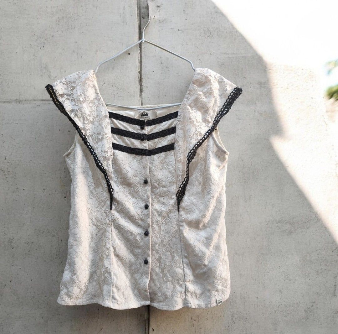Lee white Lace Blouse Black Trim Size L (Category: Blouses) located in Taguig. Submitted by deyerreC2020 (Listing ID 1467462341, Image 1). Description: sale blouse Chic white lace sleeveless blouse from branded Mr. Lee, bust 39 inc. Size L. preloved blouse Features a square neckline with black trim, three chest bands, round black buttons down the front. Fully lined and ready to wear! in good condition, need wash ..