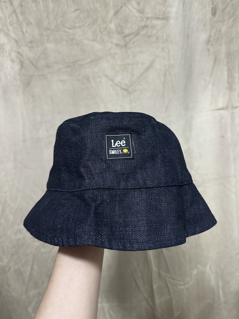 Lee x Smiley Reversible Denim and Stripe Bucket Hat (Category: Hats & Beanies) located in Manila. Submitted by jmdrgooddeals (Listing ID 1467540385, Image 2). Description: - Official Lee and Smiley collaboration bucket hat - Reversible design featuring dark denim on Side A and red and white vertical stripes on Side B - Branded patches included on both sides - Clean fabric with zero flaws, holes, or stains - Versatile accessory to elevate your dai