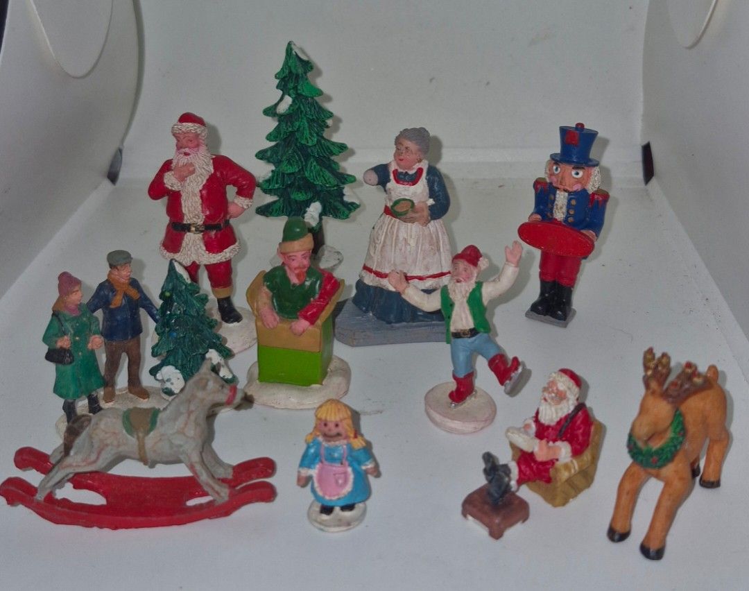 LEMAX 12 PCS Figures Lot (Category: Figurines & Statues) located in Quezon City. Submitted by belikabim2014 (Listing ID 1467395730, Image 1). Description: - Collection: Vintage Christmas figurines - Included items: Santa Claus, nutcracker, mrs claus in apron, elf in box, rocking horse, and reindeer - Material: resin -kept in storage - Perfect for: Holiday displays or miniature village setups.