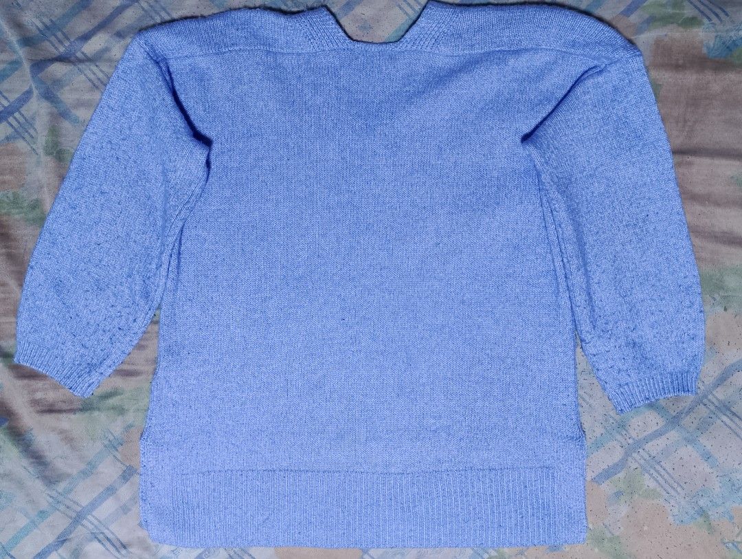 LEPSIM Blue Knit Sweater Free Size (Category: Longsleeves) located in Manila. Submitted by iced.sevi (Listing ID 1467555849, Image 2). Description: - Brand: LEPSIM - Color: Light blue - Size: Free size (fits most) - Material: 55% polyester, 34% cotton, 11% acrylic - Features: V-neck, ribbed cuffs and hem, soft textured knit - Condition: Clean, well-maintained basic layering piece - Dimes: Shoulder: 24 in Length: 26 in Width: 21 in Sleeves: 15.2 i