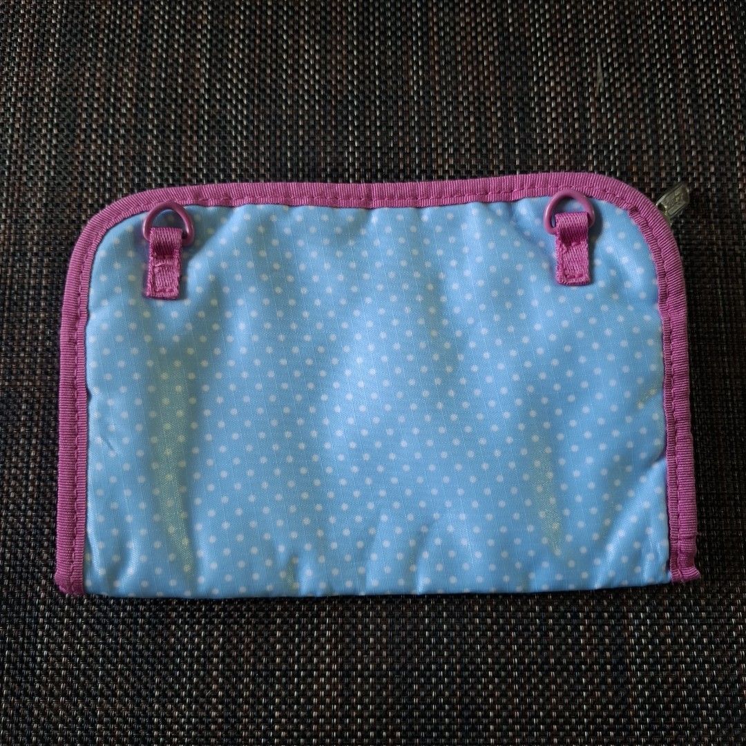 LeSportsac Blue Polka Dot Long Wallet (Category: Wallets & Card holders) located in Don Carlos. Submitted by PphiXi_Finds (Listing ID 1467439770, Image 2). Description: - Design: Light blue with white polka dots and hot pink trim - Interior: Vibrant bright pink lining - Organization: Multiple card slots, separate compartments, and a zip coin pocket - Functionality: Smooth-running zippers and lots of space for cash and cards - Condition: Great and