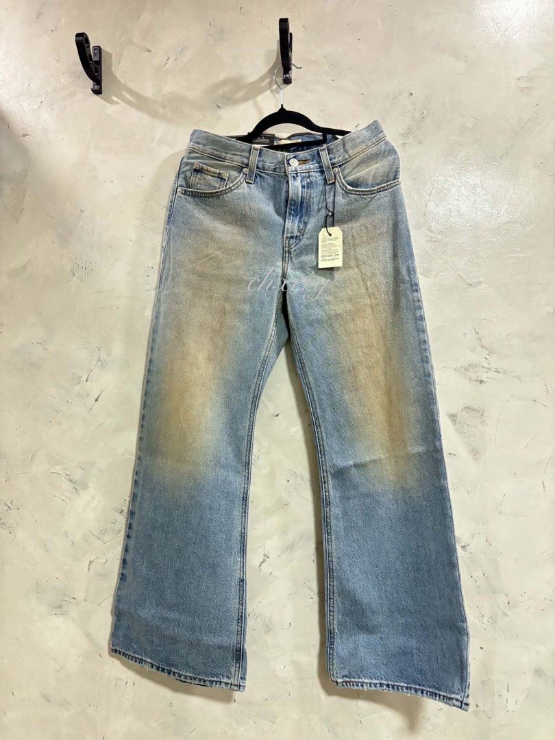 Levi's Loose Boot Jeans Size 25 (Category: Jeans) located in Quezon City. Submitted by chxrryx (Listing ID 1467504345, Image 2). Description: - Brand: Levi's (Loose Boot style) - Condition: Brand new with original store tags attached - Size: W25 L29 - Wash/Look: Light wash with unique vintage-style fading and front leg staining - Fit: High waist, relaxed through the leg, with a slight flare at the hem.