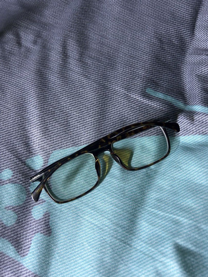 Levi's LS03098 C02 DEMI Tortoise Shell Eyewear Frames (Category: Sunglasses & Eyewear) located in Quezon City. Submitted by thriftxgoods (Listing ID 1467451099, Image 2). Description: - Brand: Levi's - Model: LS03098 C02 DEMI - Color/Pattern: Tortoise Shell (Demi) - Size: 54-17-145 - Shape: Classic rectangular with temple branding - Condition: Clean, minimal signs of handling - Lenses: Prescription lenses installed (easily replaceable at any opti