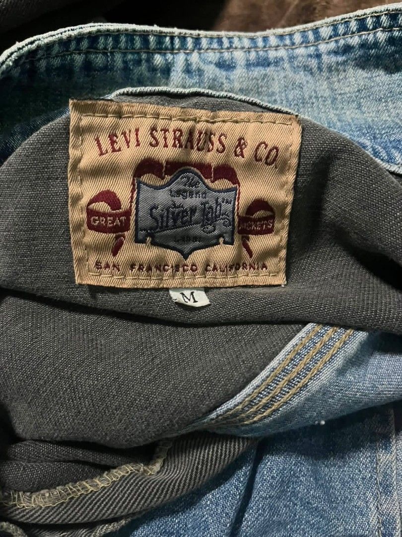 Levi's SilverTab Two-Tone Denim Jacket Medium (Category: Coats, Jackets and Outerwear) located in Manila. Submitted by athenxs (Listing ID 1467453413, Image 3). Description: - Brand: Levi's SilverTab - Style: Two-tone vintage denim jacket (Dark charcoal top / Blue denim bottom) - Size: Medium - Features: Multiple front pockets, button closure, button cuffs, and iconic SilverTab graphic patch - Condition: Excellent vintage condition, streetwear st