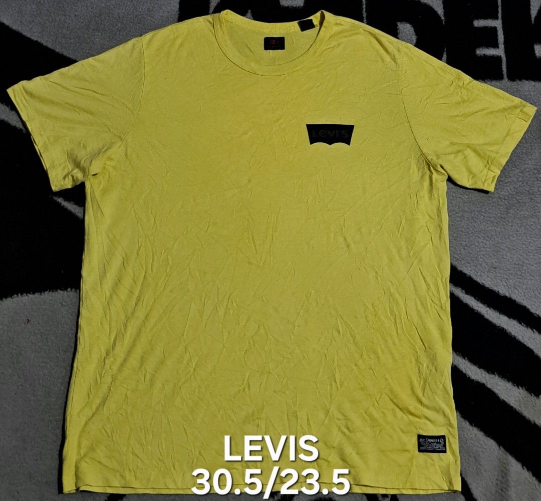 Levi's Yellow T-Shirt Size L (Category: Tshirts & Polo Shirts ) located in San Fernando, Camarines Sur. Submitted by ladderaya (Listing ID 1467445331, Image 1). Description: - Brand: Levi's - Color: Bright yellow with a small black chest logo - Size: Large (Tag inside collar) - Material: Soft 100% cotton - Fit: Regular fit, crew neck, short sleeves - Measurements: Pit-to-pit approx. 23.5", Length approx. 30.5" - Origin: Made in Pakistan - Conditi