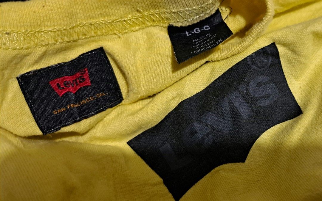 Levi's Yellow T-Shirt Size L (Category: Tshirts & Polo Shirts ) located in San Fernando, Camarines Sur. Submitted by ladderaya (Listing ID 1467445331, Image 2). Description: - Brand: Levi's - Color: Bright yellow with a small black chest logo - Size: Large (Tag inside collar) - Material: Soft 100% cotton - Fit: Regular fit, crew neck, short sleeves - Measurements: Pit-to-pit approx. 23.5", Length approx. 30.5" - Origin: Made in Pakistan - Conditi