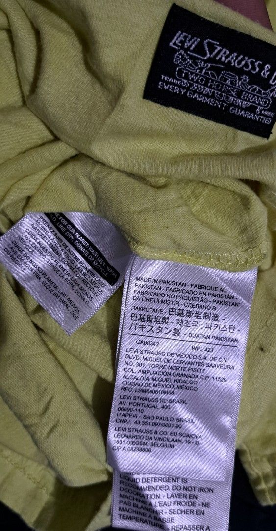 Levi's Yellow T-Shirt Size L (Category: Tshirts & Polo Shirts ) located in San Fernando, Camarines Sur. Submitted by ladderaya (Listing ID 1467445331, Image 3). Description: - Brand: Levi's - Color: Bright yellow with a small black chest logo - Size: Large (Tag inside collar) - Material: Soft 100% cotton - Fit: Regular fit, crew neck, short sleeves - Measurements: Pit-to-pit approx. 23.5", Length approx. 30.5" - Origin: Made in Pakistan - Conditi