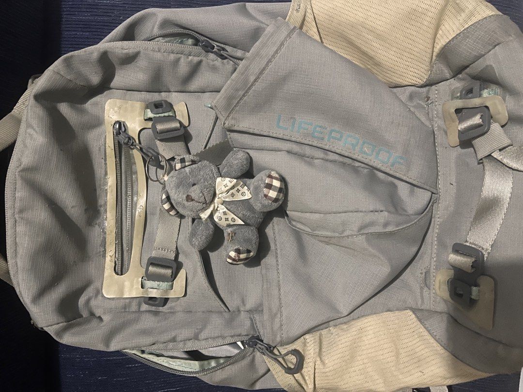 LifeProof Grey Backpack with Cute Teddy Bear Keychain (Category: Backpacks) located in Manila. Submitted by newearth.041b72 (Listing ID 1467562213, Image 2). Description: Discoloration and natanggal dikit kita sa pic sa stock ng matagal As is May tawad if kukunin agad .