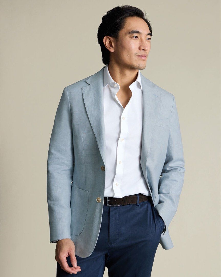 Light Blue Linen Suit Jacket Blazer (Category: Coats, Jackets and Outerwear) located in Manila. Submitted by starbalesukandjapansurplus (Listing ID 1467363286, Image 1). Description: - Style: Light blue linen blazer with a subtle textured stripe pattern - Closure: Two-button front with custom patterned brown buttons - Pockets: Front patch pockets - Details: Sleeve button accents and single back vent - Fabric: Lightweight and breathable, ideal for