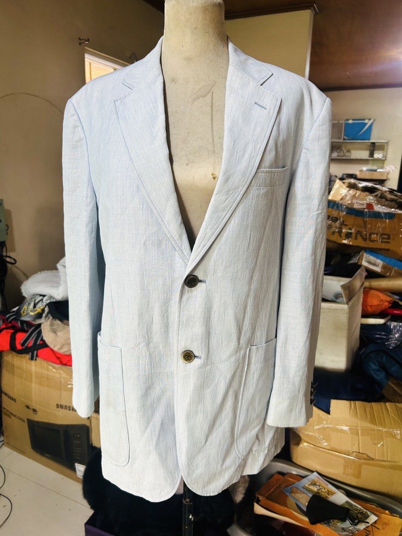 Light Blue Linen Suit Jacket Blazer (Category: Coats, Jackets and Outerwear) located in Manila. Submitted by starbalesukandjapansurplus (Listing ID 1467363286, Image 2). Description: - Style: Light blue linen blazer with a subtle textured stripe pattern - Closure: Two-button front with custom patterned brown buttons - Pockets: Front patch pockets - Details: Sleeve button accents and single back vent - Fabric: Lightweight and breathable, ideal for