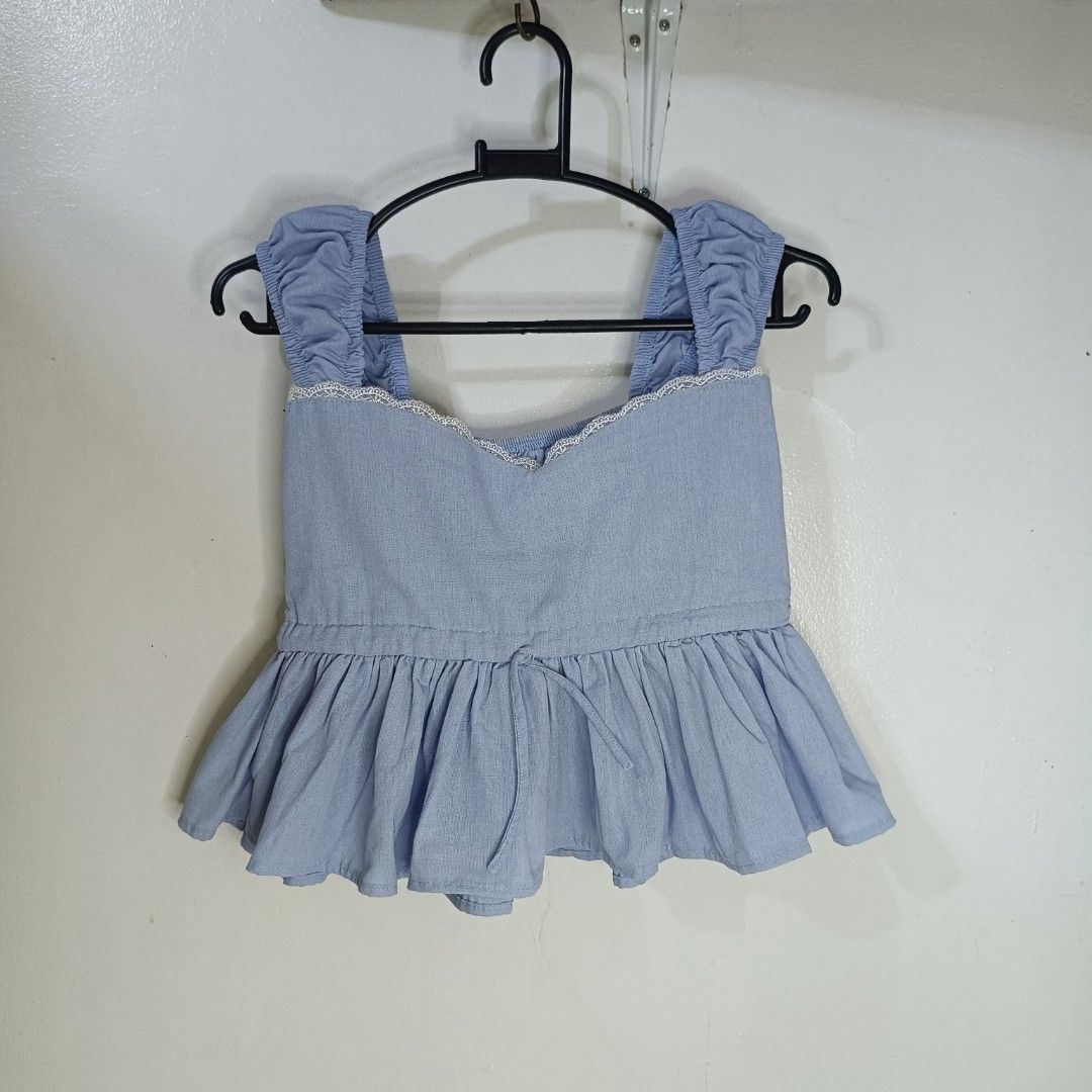Light blue Smocked Back Peplum Top (Category: Sleeveless) located in Santa Maria. Submitted by abclosetph (Listing ID 1467423678, Image 1). Description: medida size! bust: 24-28 length: 16 - unused - color may vary due to lighting. - manage your expectations, these are preloved items..