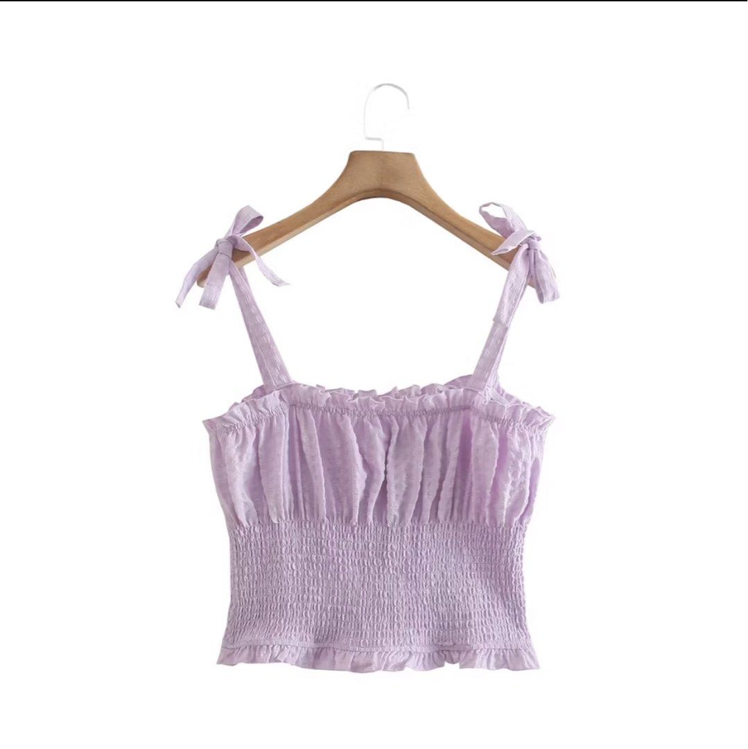 Lilac Smocked Crop Top with Tie Straps (Category: Sleeveless) located in Manila. Submitted by ktyyycloset (Listing ID 1467444973, Image 1). Description: - Color: Lilac (sweet pastel) - Style: Crop top with square neckline - Details: Tie straps on shoulders, tiny ruffles on neckline and hem, textured fabric - Fit: Stretchy smocked body that hugs the torso snugly - Condition: like new - Perfect for: Warm days, casual lakad, or cafe hopping! -Bought