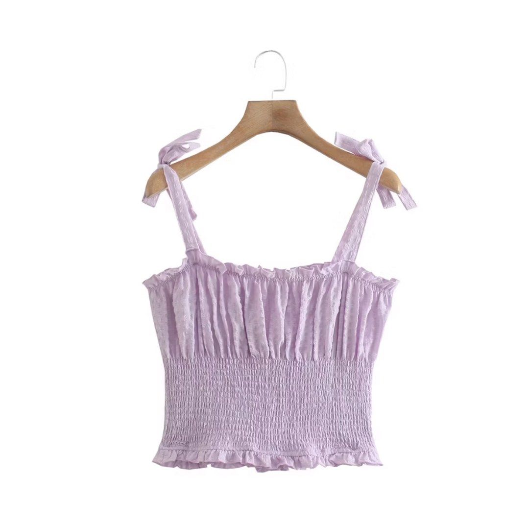 Lilac Smocked Crop Top with Tie Straps (Category: Sleeveless) located in Manila. Submitted by ktyyycloset (Listing ID 1467444973, Image 2). Description: - Color: Lilac (sweet pastel) - Style: Crop top with square neckline - Details: Tie straps on shoulders, tiny ruffles on neckline and hem, textured fabric - Fit: Stretchy smocked body that hugs the torso snugly - Condition: like new - Perfect for: Warm days, casual lakad, or cafe hopping! -Bought