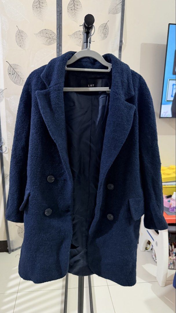 LIST Navy Blue Double Breasted winter Wool Coat (Category: Coats, Jackets and Outerwear) located in Paranaque City. Submitted by paupreloveditems (Listing ID 1467451585, Image 3). Description: - Brand: LIST -fits L-XL - Color: Navy Blue - Material: Wool with fully lined interior - Style: Double-breasted with structured lapels and large buttons - Features: Functional front pockets - Fit: Classic silhouette that fits nicely over sweaters - Conditio