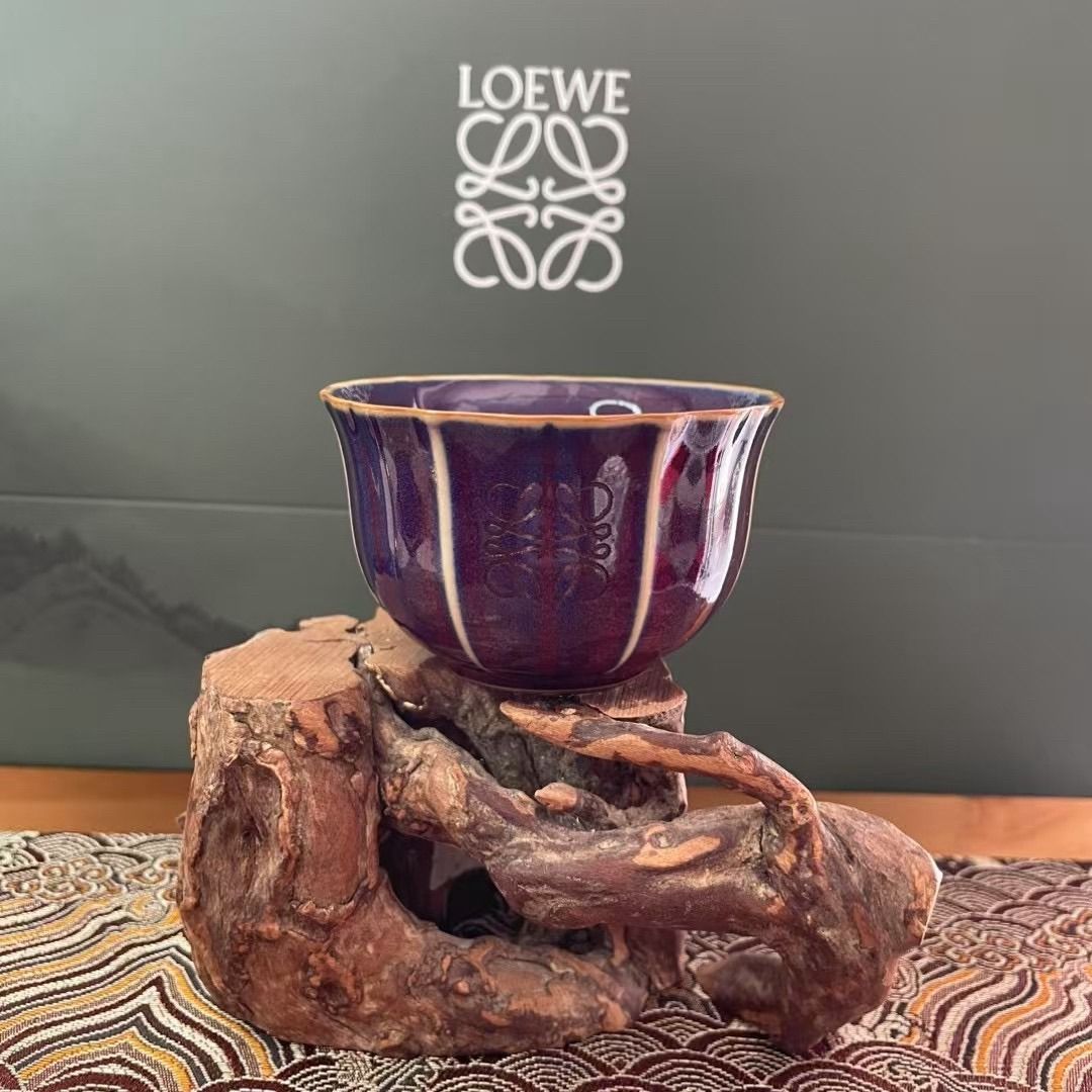 LOEWE Tea Set with Portable Case (Category: Coffee & Tea Tableware) located in Quezon City. Submitted by reifancova27621 (Listing ID 1467467525, Image 3). Description: - Brand new LOEWE ceramic tea set with a luxury grey round zip case - Includes 1 teapot with a braided handle and 5 uniquely glazed cups - Comes with a wooden tea coaster, certificate card, and cleaning sponge - Features stunning landscape artwork inside the case lid - Ideal for te
