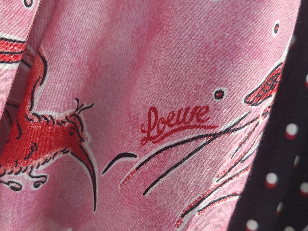 LOEWE x Paula's Ibiza Patchwork Long Sleeve Dress ( Authentic ) (Category: Dresses) located in Cebu City. Submitted by thehiddengemsbykid (Listing ID 1467510051, Image 3). Description: LOEWE piece from the Paula's Ibiza collaboration. Long sleeve patchwork midi or maxi dress mixing prints like polka dots, stripes, birds, and elephants. Yellow, black, white, and pink panels. Ties at the neckline. Made in Romania. Designer branding printed directly