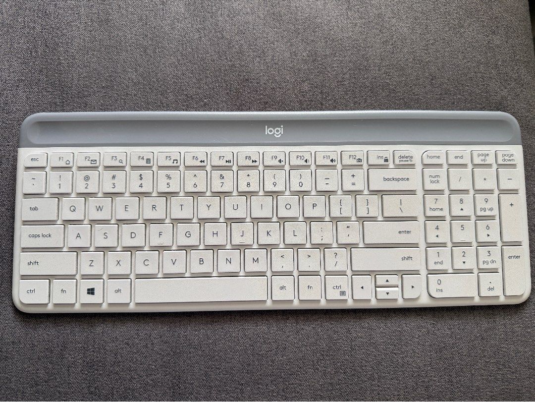 Logitech K470 Slim Multi-Device Wireless Keyboard White (Category: Computer Keyboard) located in Angeles City. Submitted by arduino-lover (Listing ID 1467466035, Image 1). Description: - Model: Logitech K470 Wireless Keyboard - Color: White and Grey - Layout: Full layout with a numeric keypad - Design: Ultra-slim profile with quiet keys and a clean surface with minimal wear - Connectivity: Works smoothly with USB receiver - Benefit: Great space s