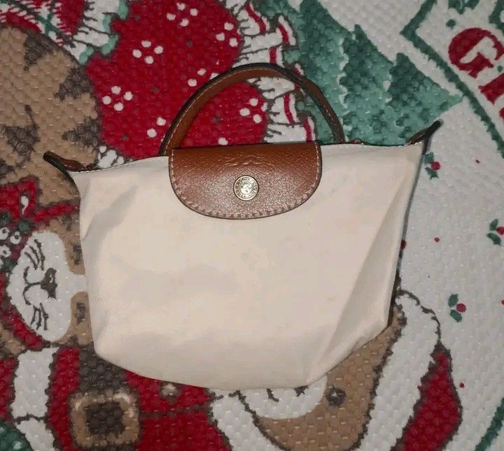 LONGCHAMP (Category: Purses & Pouches) located in Taguig. Submitted by clothingselection (Listing ID 1467475725, Image 3). Description: PTPA LONGCHAMP HANDBAG WIDTH 8 LENGTH 6 VERYGOOD CONDITION NID WASH FRESH FROM BALE.