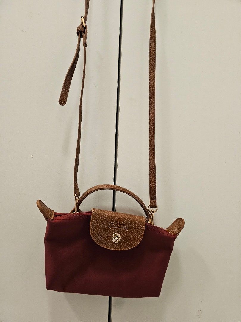 Longchamp 2 way sling bag (Category: Cross-body Bags) located in Cavite. Submitted by rsfleur (Listing ID 1467448683, Image 2). Description: nylon - Details: Dark leather shoulder strap, trim, and silver-tone hardware - Accessories: Includes white tag, orange presentation boxes - Interior: secure snap button closure - Condition: well-maintained - Meetup or shipping options available across the Philippines.