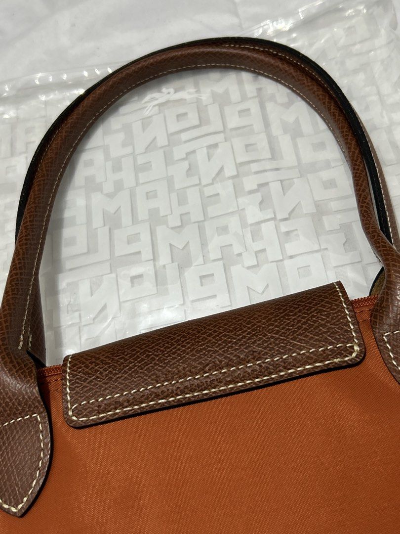 Longchamp Le Pliage Brique (Category: Luxury Bags & Wallets) located in Quezon City. Submitted by luxurybyluci (Listing ID 1467601101, Image 3). Description: Longchamp Le Pliage Brique Medium & Large 7,000 Medium 7,500 Large with inclusion authentic .