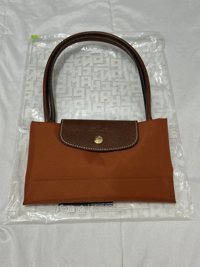 Longchamp Le Pliage Brique (Category: Luxury Bags & Wallets) located in Quezon City. Submitted by luxurybyluci (Listing ID 1467601101, Image 1). Description: Longchamp Le Pliage Brique Medium & Large 7,000 Medium 7,500 Large with inclusion authentic .