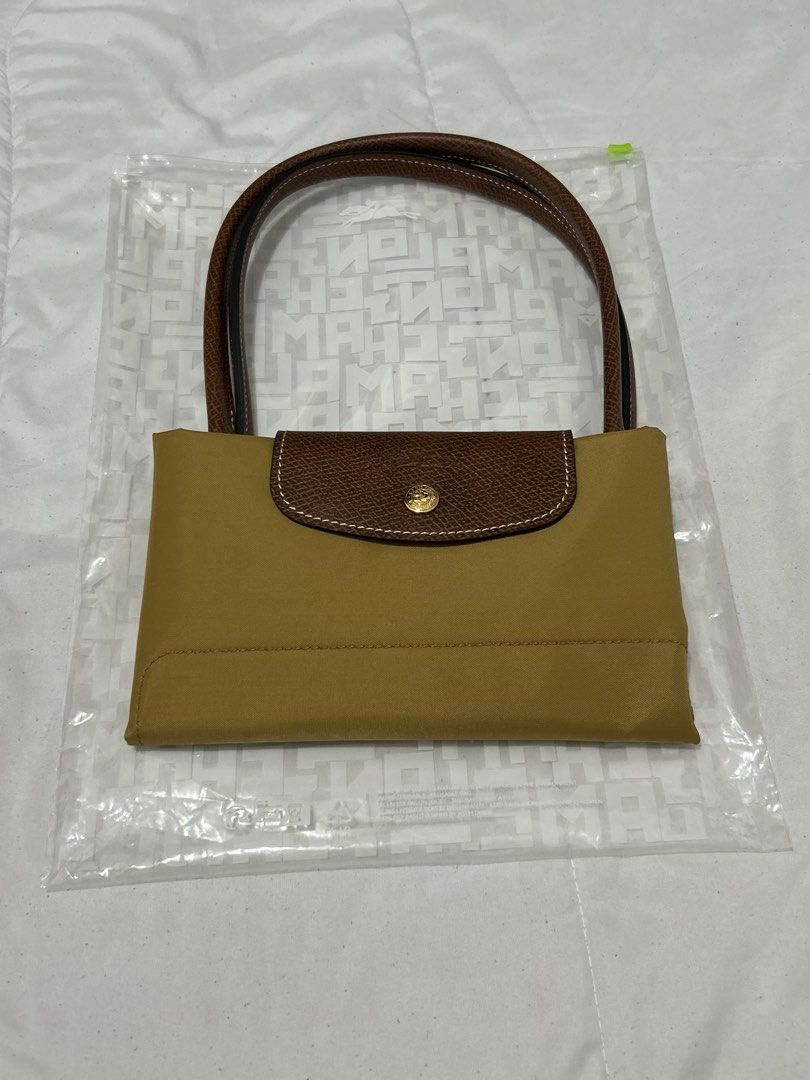 Longchamp Le Pliage Chamois (Category: Luxury Bags & Wallets) located in Quezon City. Submitted by luxurybyluci (Listing ID 1467601017, Image 1). Description: Longchamp Le Pliage Chamois Medium & Large 7,000 Medium 7,500 Large with inclusion authentic .