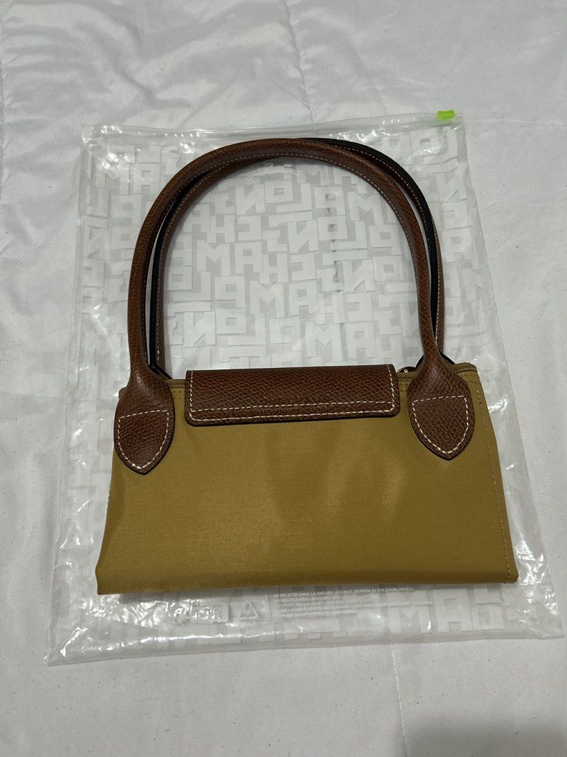 Longchamp Le Pliage Chamois (Category: Luxury Bags & Wallets) located in Quezon City. Submitted by luxurybyluci (Listing ID 1467601017, Image 2). Description: Longchamp Le Pliage Chamois Medium & Large 7,000 Medium 7,500 Large with inclusion authentic .