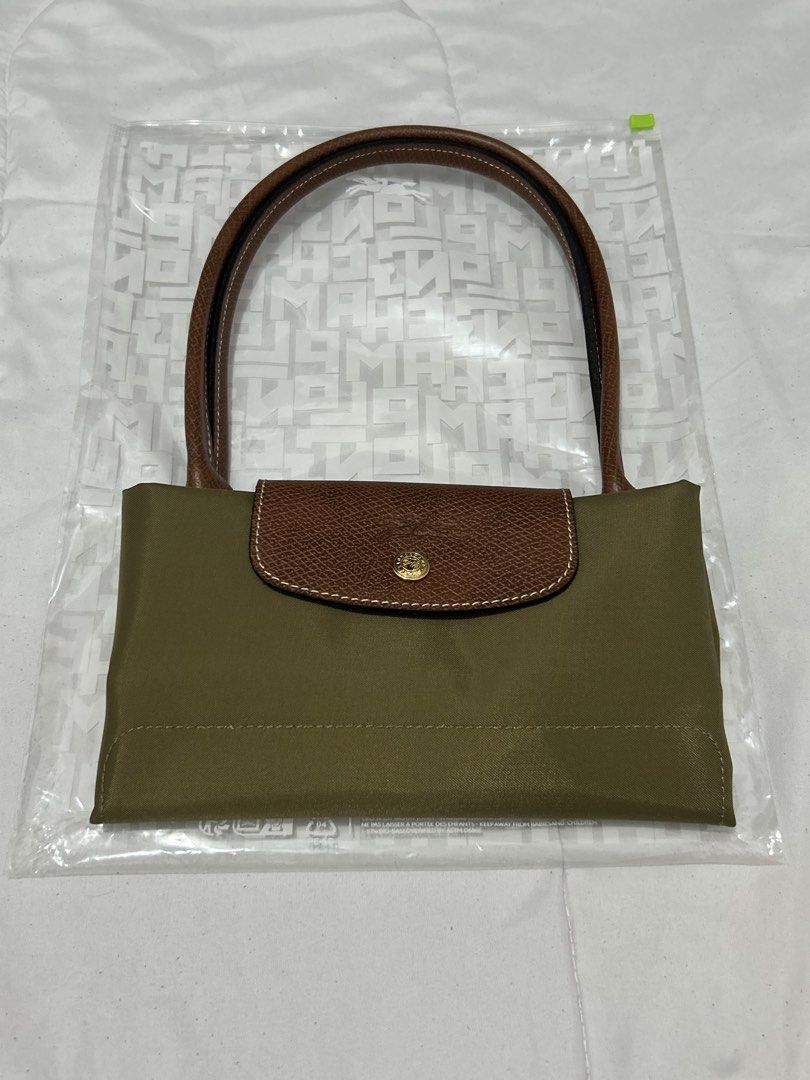 Longchamp Le Pliage Khaki (Category: Luxury Bags & Wallets) located in Quezon City. Submitted by luxurybyluci (Listing ID 1467601212, Image 1). Description: Longchamp Le Pliage Khaki Medium & Large 7,000 Medium 7,500 Large with inclusion authentic .