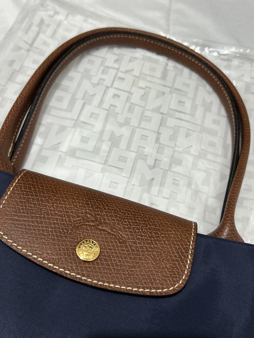 Longchamp Le Pliage Marine (Category: Luxury Bags & Wallets) located in Quezon City. Submitted by luxurybyluci (Listing ID 1467601176, Image 2). Description: Longchamp Le Pliage Marine Medium & Large 7,000 Medium 7,500 Large with inclusion authentic .