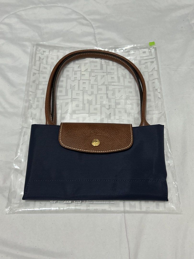 Longchamp Le Pliage Marine (Category: Luxury Bags & Wallets) located in Quezon City. Submitted by luxurybyluci (Listing ID 1467601176, Image 1). Description: Longchamp Le Pliage Marine Medium & Large 7,000 Medium 7,500 Large with inclusion authentic .