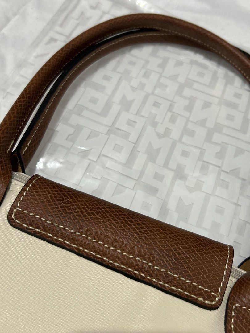 Longchamp Le Pliage Papier (Category: Luxury Bags & Wallets) located in Quezon City. Submitted by luxurybyluci (Listing ID 1467601143, Image 3). Description: Longchamp Le Pliage Papier Medium & Large 7,000 Medium 7,500 Large with inclusion authentic .