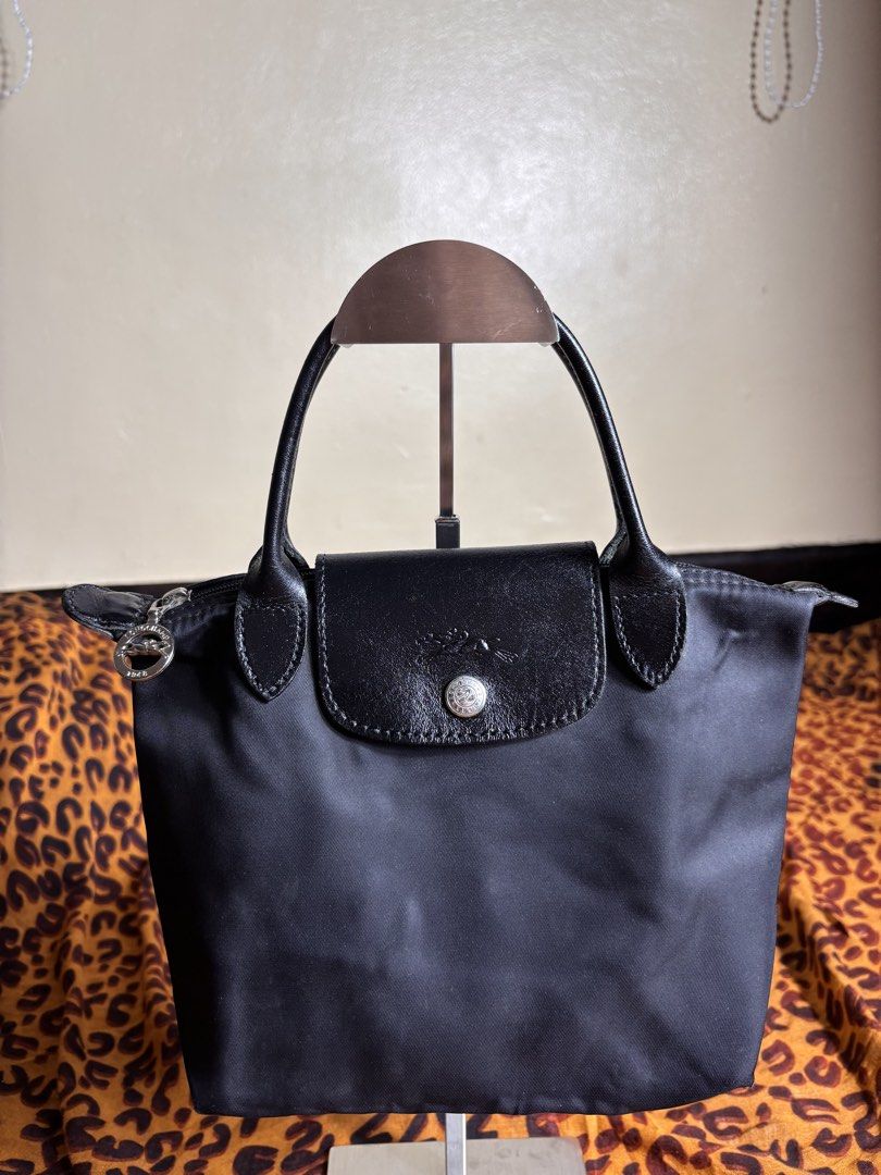 LongChamp Nylon Tote (Category: Tote Bags) located in Manila. Submitted by earlylifecrisis3 (Listing ID 1467458291, Image 2). Description: Condition 8/10 Measure it by inch Width: 10.5 Length: 7.5 Depth: 5 Handle:4 •Refund / Returns not allowed allowed •Please do check the dimensions size on labels sometimes are not accurate on the sizing •Ask me before purchasing.